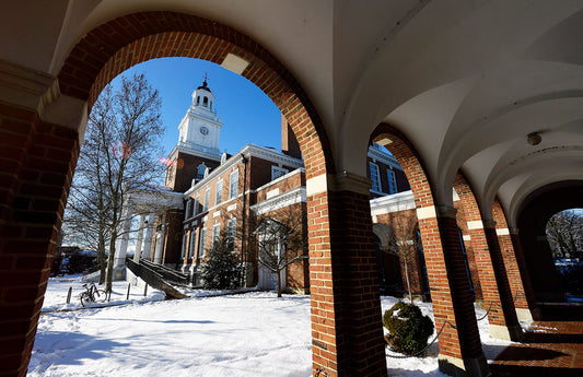 Gilman Hall in the snow viewed from one of its adjoining brick colonnades-Will Kirk 18