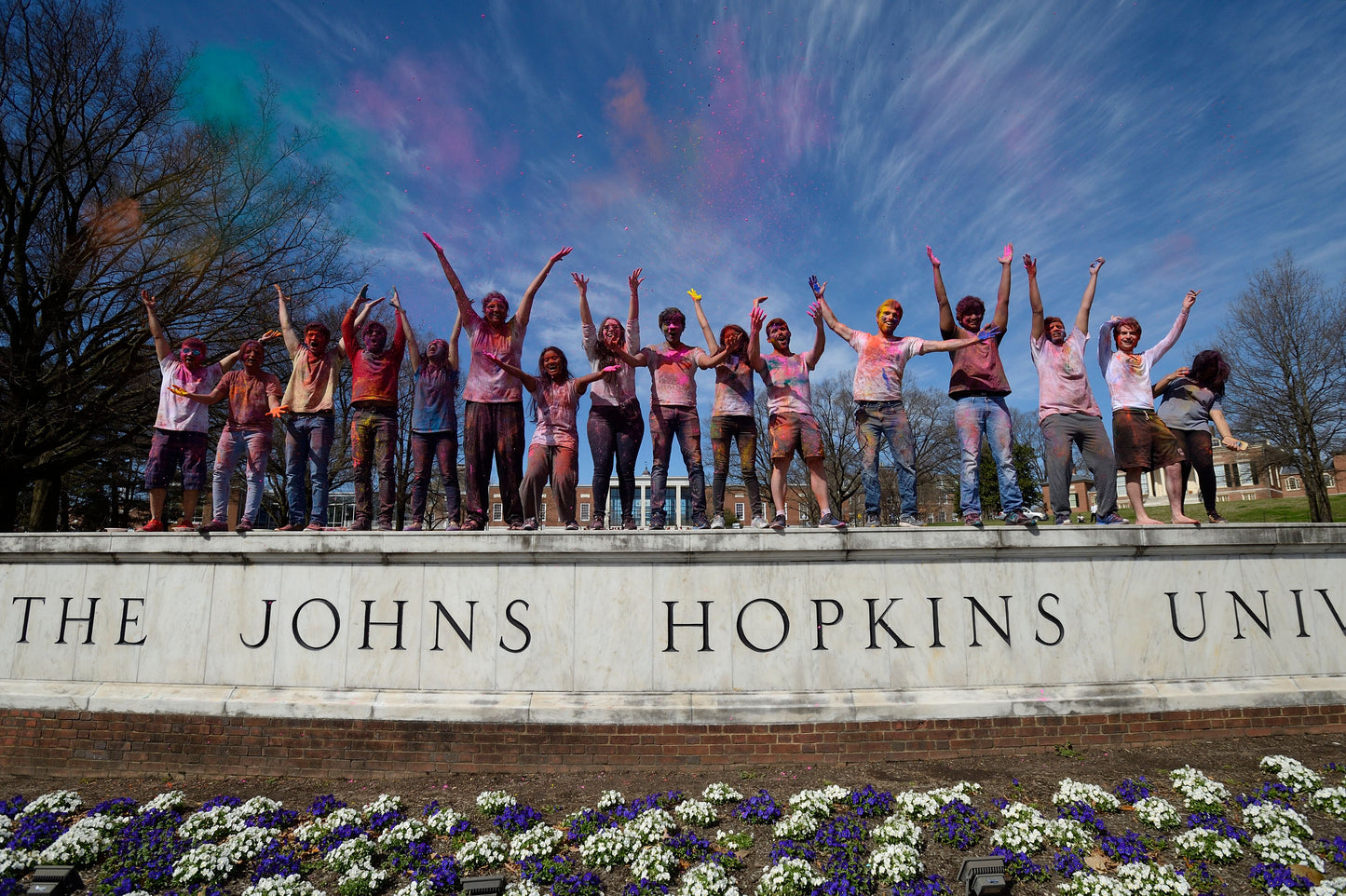 Students celebrating Holi on the JHU wall at the Beach-Will Kirk 19